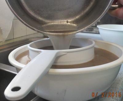 Strain the broth a second time, this time through muslin material or a very fine sieve to remove all the smallest meat and bone particles left in the mixture. Discard the bone and meat strained off.