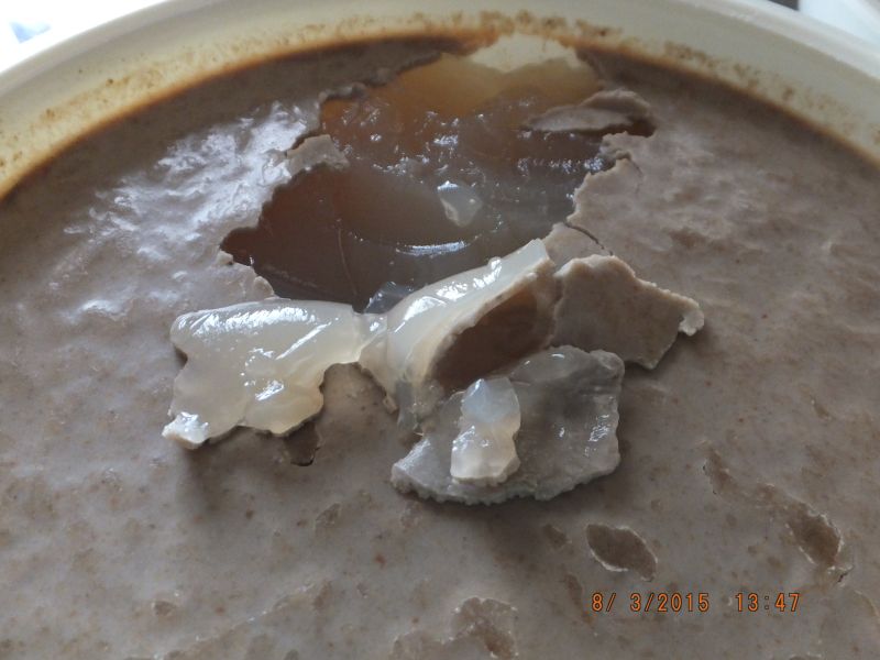 Once set, there will be a fatty type layer on top. Take this off and discard it. The rest will be a brownish jelly and ready to use.